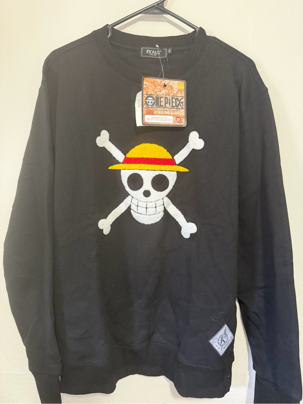 Onepiece Black Crewneck Sweater with Yellow & Red Straw Hat Skull Patch.